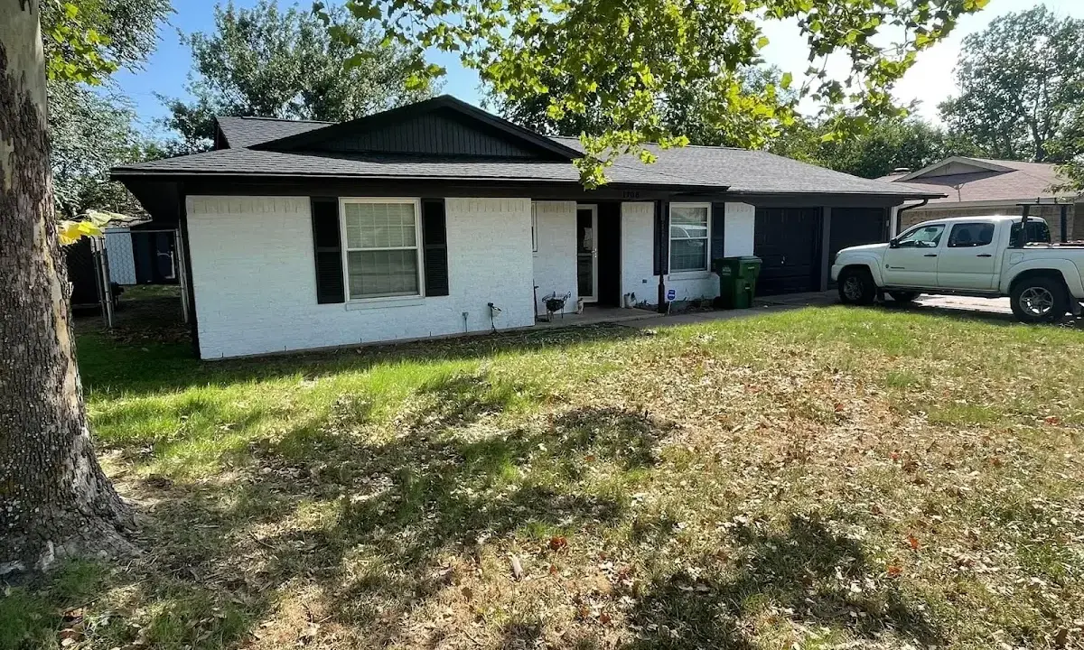Professional roofing crew working on a residential roof in Pueblo West